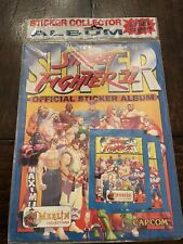 (1) Álbum de pegatinas oficiales del juego Super Street Fighter 2 sellado de Merlin Capcom segunda mano  Embacar hacia Mexico