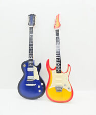 2 figuras Stye modelo de guitarra eléctrica en miniatura Gibson (azul) e Ibanez (amarillo) de 9,5" segunda mano  Embacar hacia Argentina