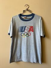 CAMISETA VINTAGE ANOS 1980 LEVIS OLYMPIC RINGER 50/50 FEITA NOS EUA TAMANHO L comprar usado  Enviando para Brazil