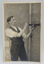 RPPC~Man Holding Birdcage Bird~Cigarette in Mouth~Magic Trick?~Photo Postcard for sale  Shipping to South Africa