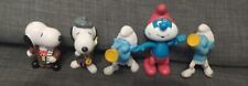 McDonald's Happy Meal zabawki: (2) 1999 Snoopy 2002 Pappa Smerf 2012 Harmony Smerf na sprzedaż  PL