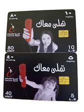 2 tarjetas telefónicas egipcias publicidad de personas que usan el teléfono. En buen estado. segunda mano  Embacar hacia Mexico