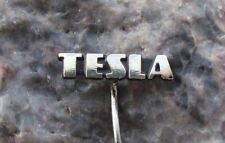 Antigua insignia de pasador negro con logotipo en letra mayúscula de Tesla Electronics firma segunda mano  Embacar hacia Argentina
