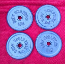 Four weight plates for sale  WREXHAM
