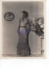 Lilian Harvey stands between a painting and flowers VINTAGE Photo for sale  Shipping to Canada