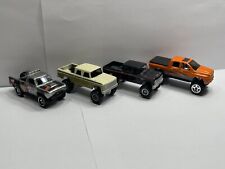 Lote de 4 camionetas 1/64 Hot Wheels (2- Dodge D200, 3 generaciones Ram 1500, Dodge D100) segunda mano  Embacar hacia Argentina
