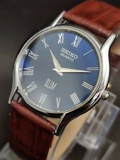 Reloj de pulsera Seiko delgado cuarzo azul cara romana banda marrón hecho en Japón para hombre segunda mano  Embacar hacia Argentina