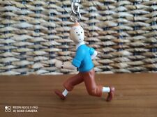 Très très rare figurine porte clé Tintin qui court pull bleu d'occasion  La Ciotat