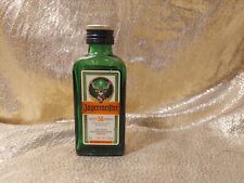 Etiqueta de papel de botella vintage JAGERMEISTER 50 ml con lados en relieve, vidrio verde, usado segunda mano  Embacar hacia Argentina