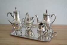 Service à café, à thé argent richement décoré forme ovoïde  Empire, occasion d'occasion  Courcy