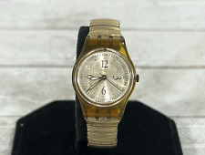 Reloj analógico para mujer Swatch 1997 24 mm dorado estuche translúcido correa elástica, usado segunda mano  Embacar hacia Argentina