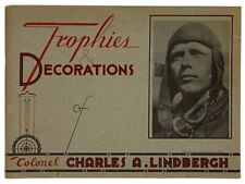 Ilustraciones de las condecoraciones del coronel Charles Lindbergh y algunos de sus trofeos. segunda mano  Embacar hacia Argentina