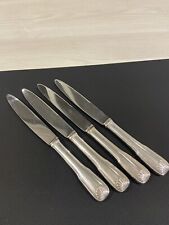 4 couteaux manches en métal argenté poinçon OC modèle coquille Christofle  d'occasion  Muizon