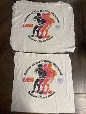 Dos camisetas de fútbol vintage de los Juegos Olímpicos de 1984, CORTE - SOLO LOS GRÁFICOS FRONTALES segunda mano  Embacar hacia Argentina