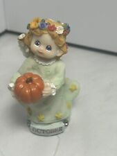 Estatueta de abóbora 4 em Angel Holding, outubro, flores no cabelo, olhos azuis, estrelas comprar usado  Enviando para Brazil