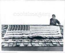 1977 Press Photo Americana Patriotic Man Puts Flag on Wood Shingle Roof for sale  Shipping to United Kingdom