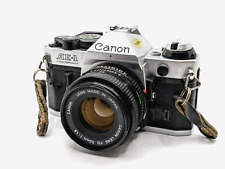 Programa Canon AE-1 con cámara fotográfica de 50 mm 1,8 - 35 mm - probada, funciona, lee segunda mano  Embacar hacia Argentina