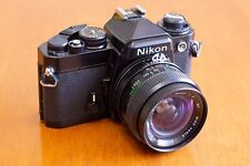 Cámara de película Nikon FE con lente gran angular de 24 mm. Excelente estado de funcionamiento segunda mano  Embacar hacia Argentina