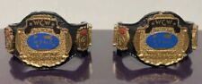 LOTE CINTURÓN FIGURA LUCHA LIBRE WWE MATTEL WCW TAG TEAM CHAMPIONSHIP WWF BONITO RARO AÑOS 90 segunda mano  Embacar hacia Argentina