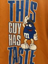 Camiseta gráfica 2009 M&M'S This Guy Has Taste laranja azul doce tamanho 2XL, usado comprar usado  Enviando para Brazil