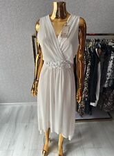 Biała MIDI sukienka kopertowa uniwersalna na sprzedaż  PL