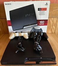 CONSOLA SONY PS3 DELGADA 160GB NEGRO CARBÓN CON DOS CONTROLADORES Y CAJA segunda mano  Embacar hacia Argentina