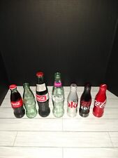 Lote de 7 botellas de vidrio y aluminio de Coca Cola varios tamaños y condiciones  segunda mano  Embacar hacia Mexico