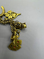 VINTAGE 1950s CORO BRASS CHARM BRACELET~ladder~cat~horse shoe~cards~clover, used for sale  USA
