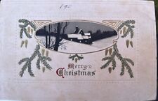Postal de Feliz Navidad 1911 casa de nieve escena árbol piñas noche segunda mano  Embacar hacia Argentina