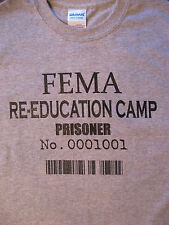 Camiseta ""Prisionero"" campo de reeducación de FEMA. Camisa gris con tinta negra segunda mano  Embacar hacia Argentina