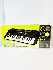Mini teclado electrónico CASIO SA-46 negro y verde 32 teclas 100 tonos piano/órgano, usado segunda mano  Embacar hacia Argentina