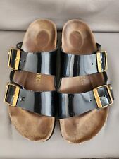 Usado, Sandalias Birkenstock Arizona con hebilla grande deslizantes oro negro patente cuero talla 38 segunda mano  Embacar hacia Argentina