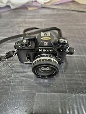 Cámara fotográfica Nikon EM 35 mm SLR equipada con lente Nikon 50 mm 1:1,8 totalmente funcional segunda mano  Embacar hacia Argentina