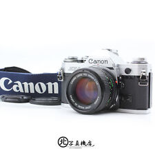 [W IDEALNYM STANIE] Canon AE-1 srebrny 35m Korpus aparatu filmowego NOWY FD 50mm f1.4 Obiektyw z Japonii na sprzedaż  Wysyłka do Poland