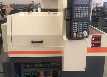 Automat tokarski, tokarka CNC + podajnik pręta na sprzedaż  Rzeszotary