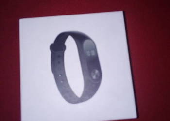 Pudełko z ładowarką i gumową opaską Xiaomi Mi Band 2, używany na sprzedaż  Dębica