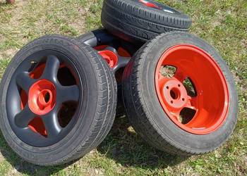 Używany, Alufelgi czarno-czerwone z oponami 4 x 108 195/55 r.15 na sprzedaż  Białystok
