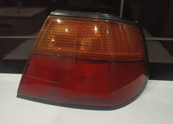 Używany, Nissan Almera N15 hatchback lampa tył tylna prawa w błotnik na sprzedaż  Sieradz